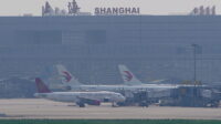 China Eastern Airlines aircraft are seen parked on the tarmac in Hongqiao International Airport in Shanghai China Batalkan Lebih dari 9.000 Penerbangan di Tengah Isu Kudeta