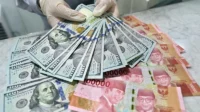Rupiah Melemah, Nyaris Sentuh Rp18.100 per Dolar AS
